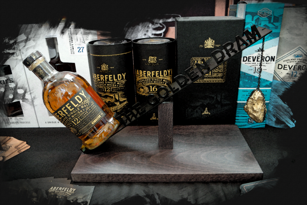 A bottle of Aberfeldy 12 shown outweighing a nugget of gold. A promotional item from the stand.