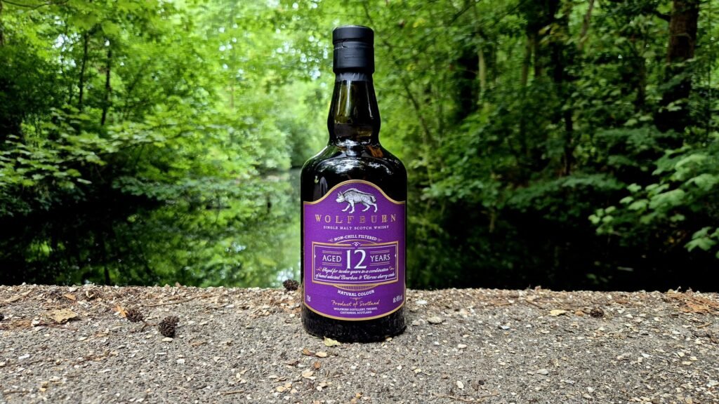Wolfburn 12 in a forrest, for a whisky review