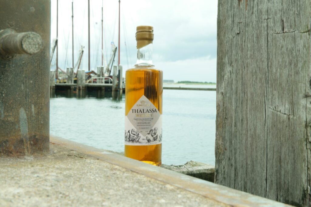 A bottle of Thalassa Ardbeg Oloroso in the harbour of Terschelling