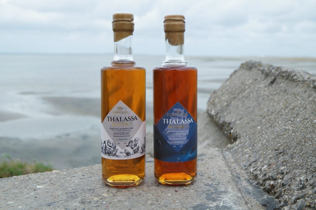 a bottle of Thalassa Ardbeg Winter edition on the shores of Terschelling