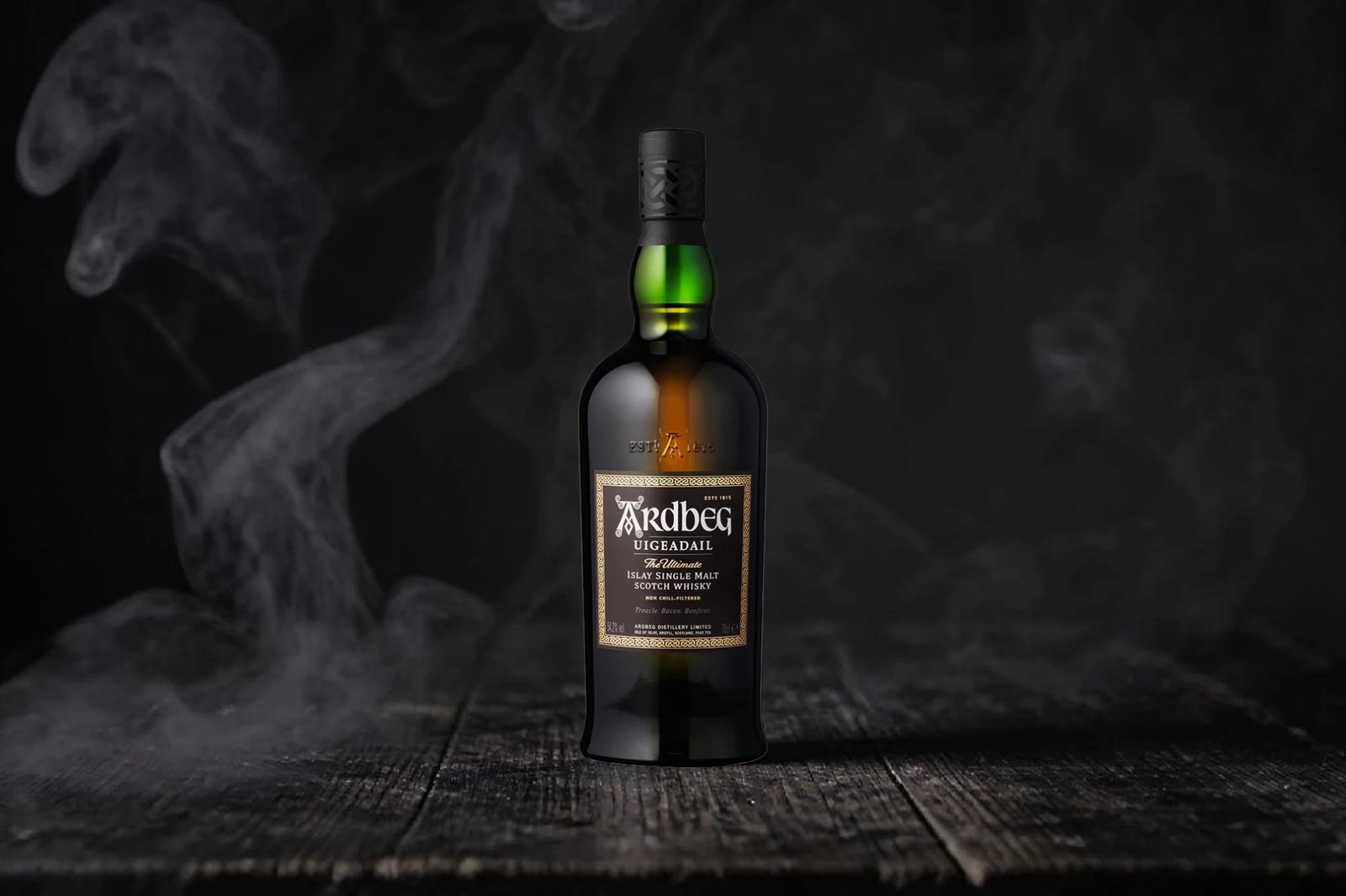 Ardbeg Uigeadail bottle with smoke on dark background