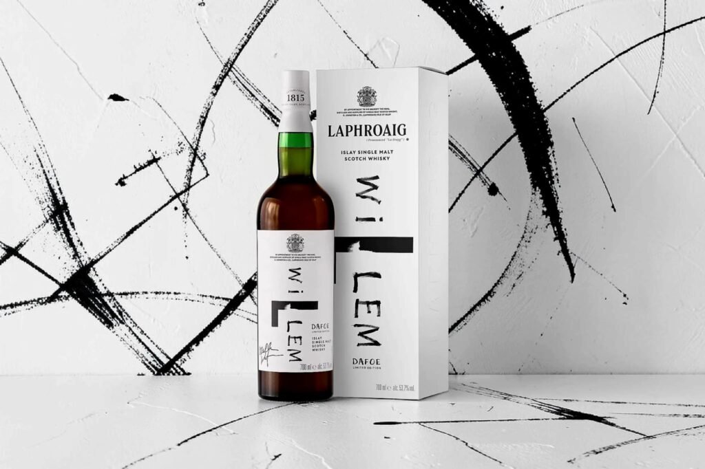 Laphroaig Willem Dafoe Limited Edition 14 Year Old Islay single malt whisky bottle with minimalist white box packaging against abstract black brushstroke background