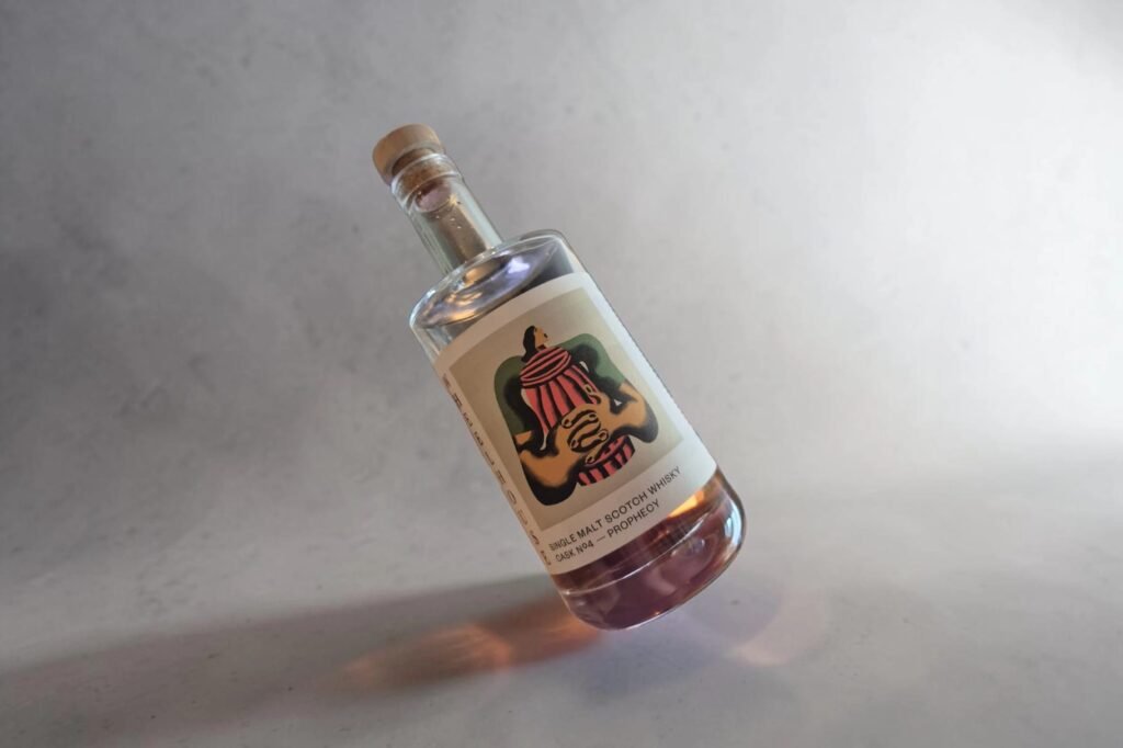 Wheelhouse Prophecy bottle by MacMillan Spirits Co. photographed at an angle against a neutral background