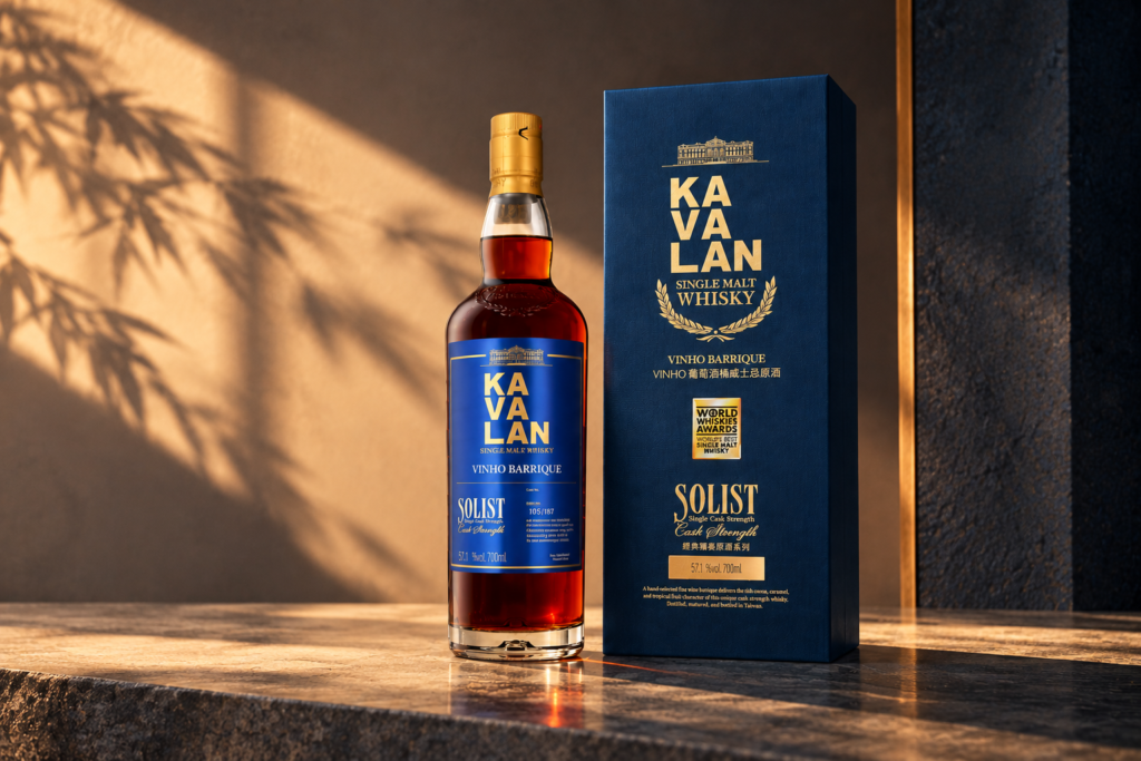 Kavalan Solist Vinho Barrique 57.1% single malt whisky bottle and blue presentation box against a minimalist Asian-inspired background.